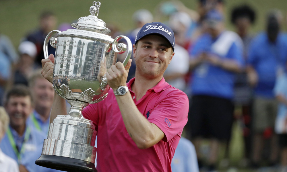 Justin Thomas poses with the Wanamaker Trophy after winning the PGA Championship golf tournament at the Quail Hollow Club Sunday, Aug. 13, 2017, in Charlotte, N.C. (AP Photo/Chris O'Meara) ORG XMIT: PGA199